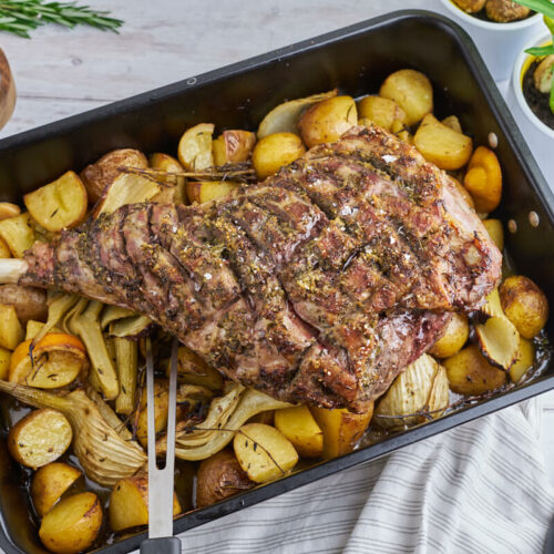 slow-roasted leg of lamb on potatoes and fennel