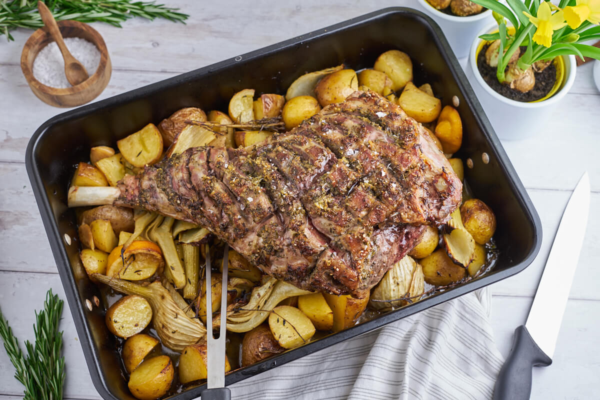 slow-roasted leg of lamb on potatoes and fennel