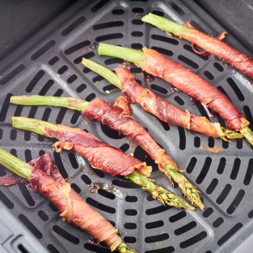 air fryer prosciutto wrapped asparagus in air fryer basket