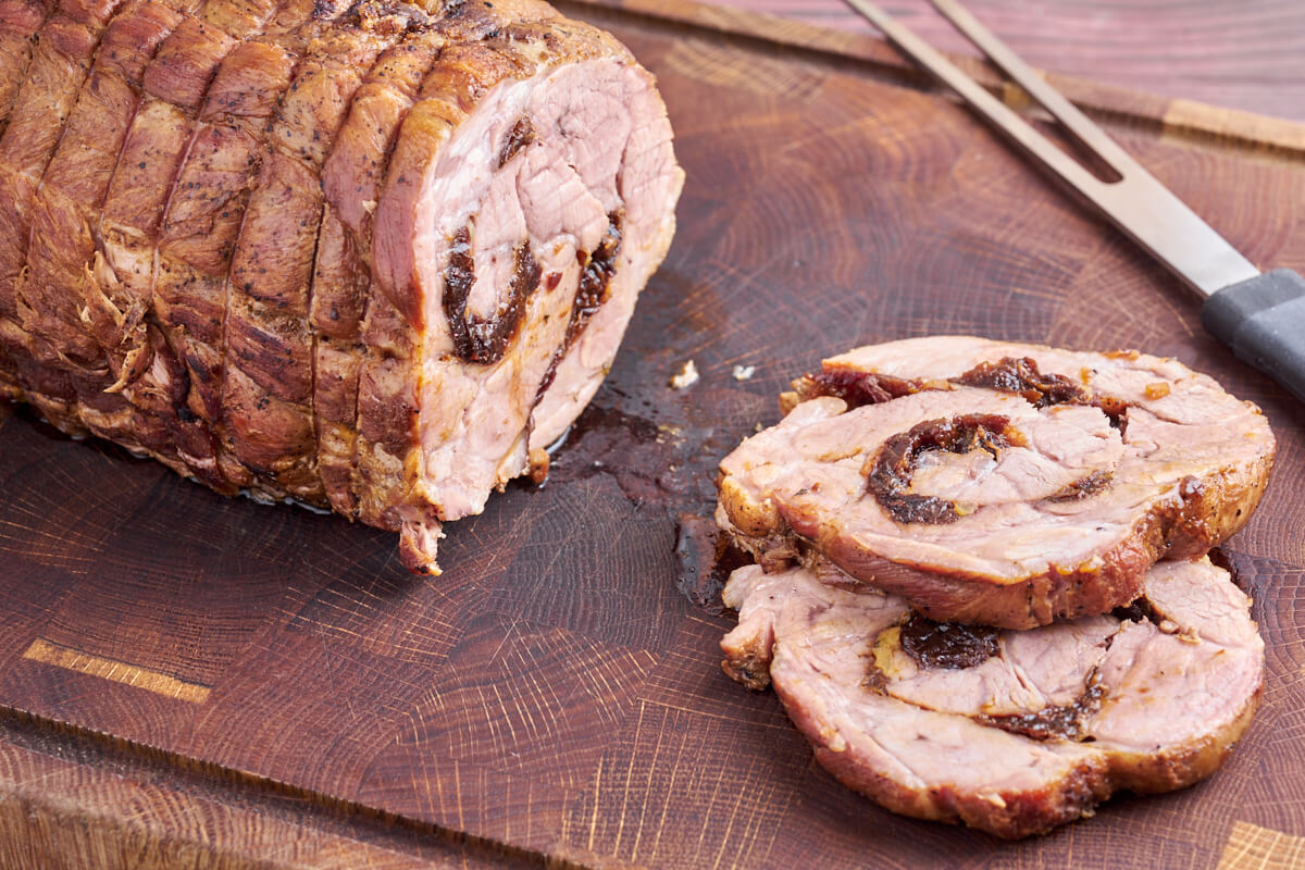 rolled pork collar roast stuffed with prunes and apples and thyme