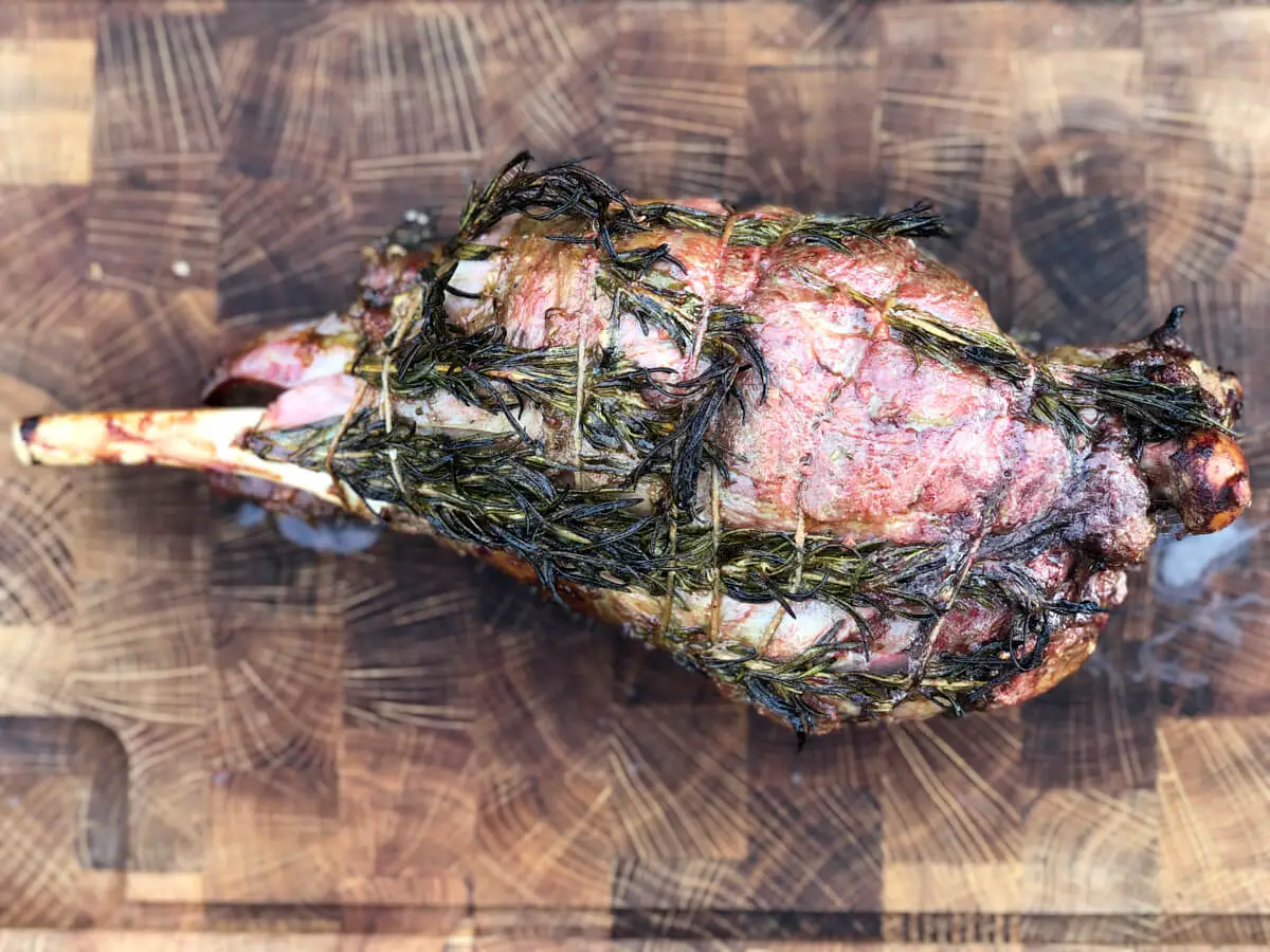grilled leg of lamb on cutting board