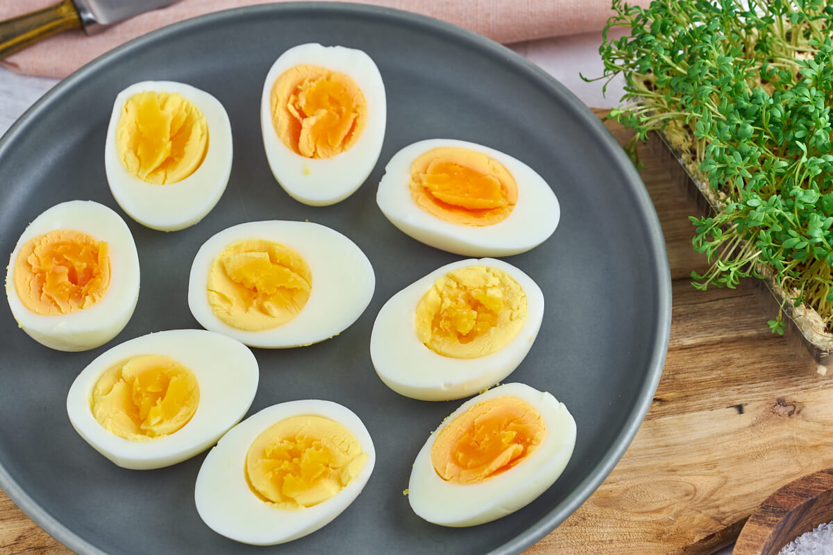 hard boiled eggs on plate with watercress