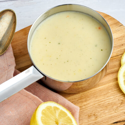 lemon sauce for fish or chicken in sauce pan with spoon end lemons