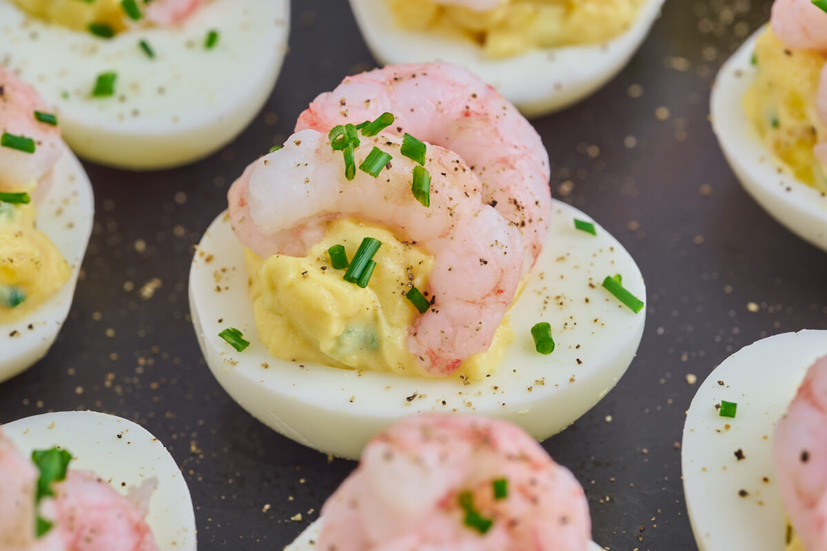 filled eggs for easter with shrimp on top