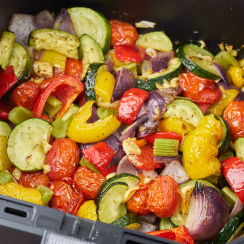 air fryer Italian vegetables with squash bell pepper tomatoes and onion
