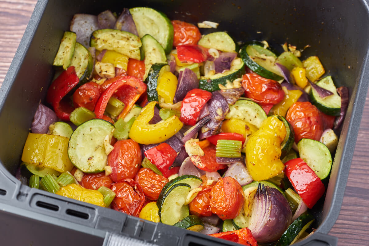 air fryer Italian vegetables with squash bell pepper tomatoes and onion