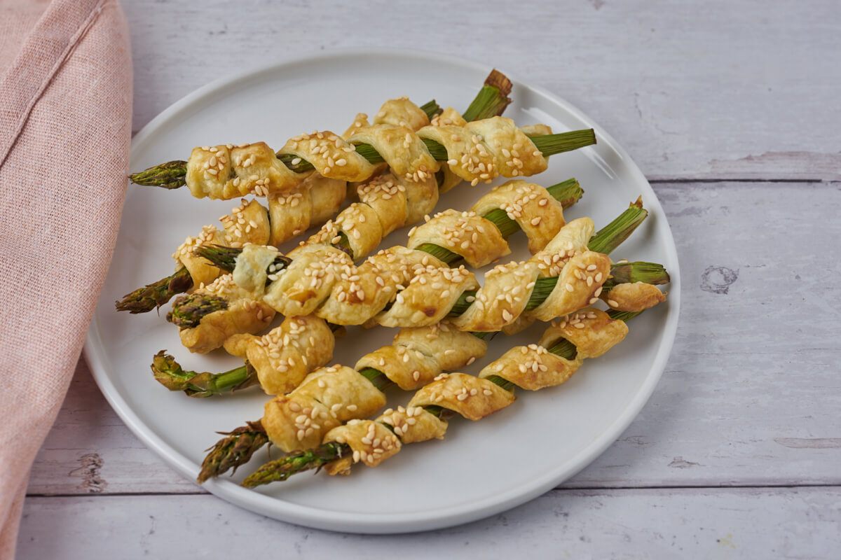 plate with puff pastry wrapped asparagus made in air fryer