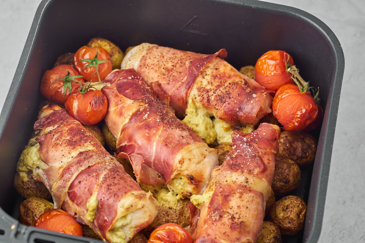 air fryer meal with chicken, potatoes and tomatoes