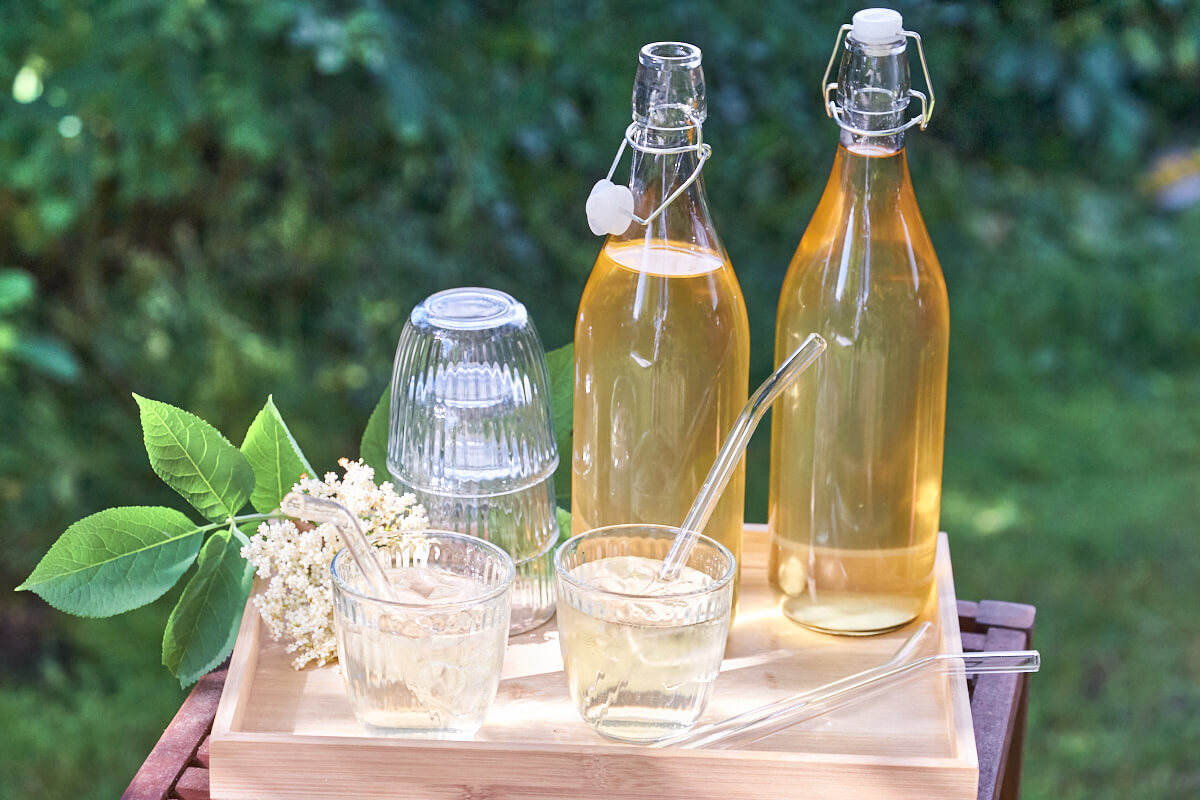 elderflower cordial in bottles and glasses