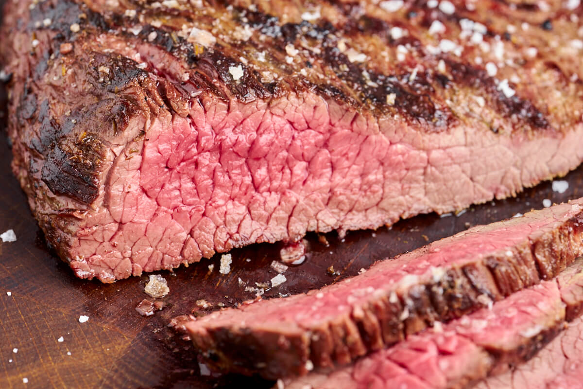 flank steak cooked on the grill