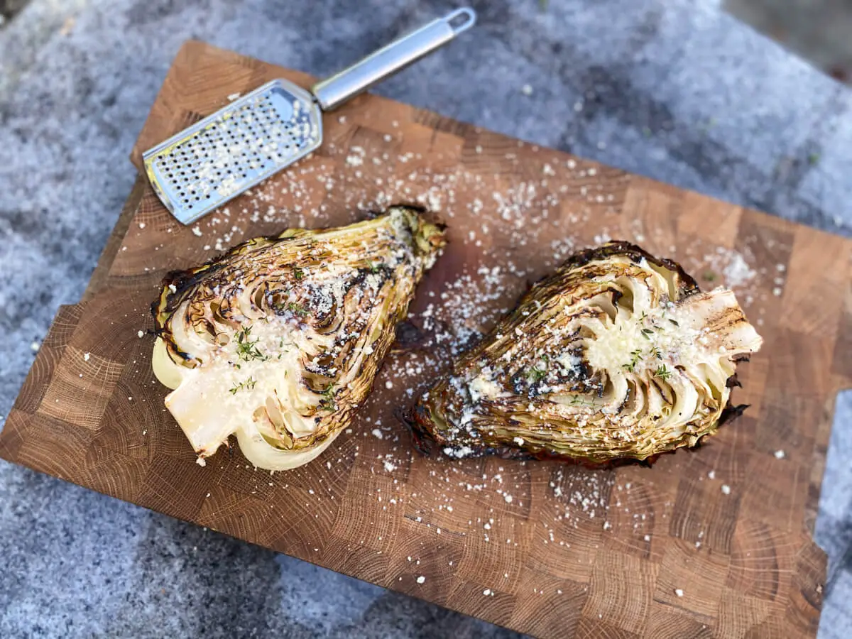 wooden board with grilled pointed cabbage