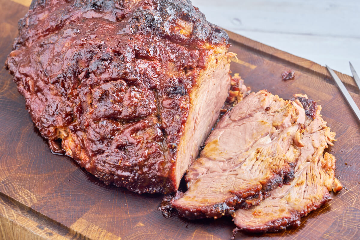 Grilled pork collar with bbq rub and bbq sauce