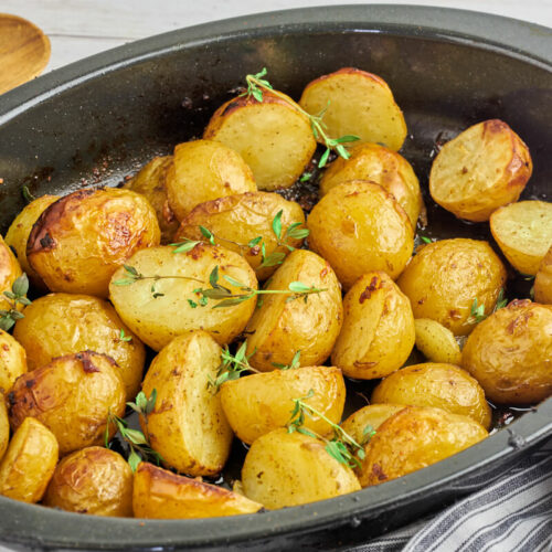grilled potatoes with herbs in ovenproof dish