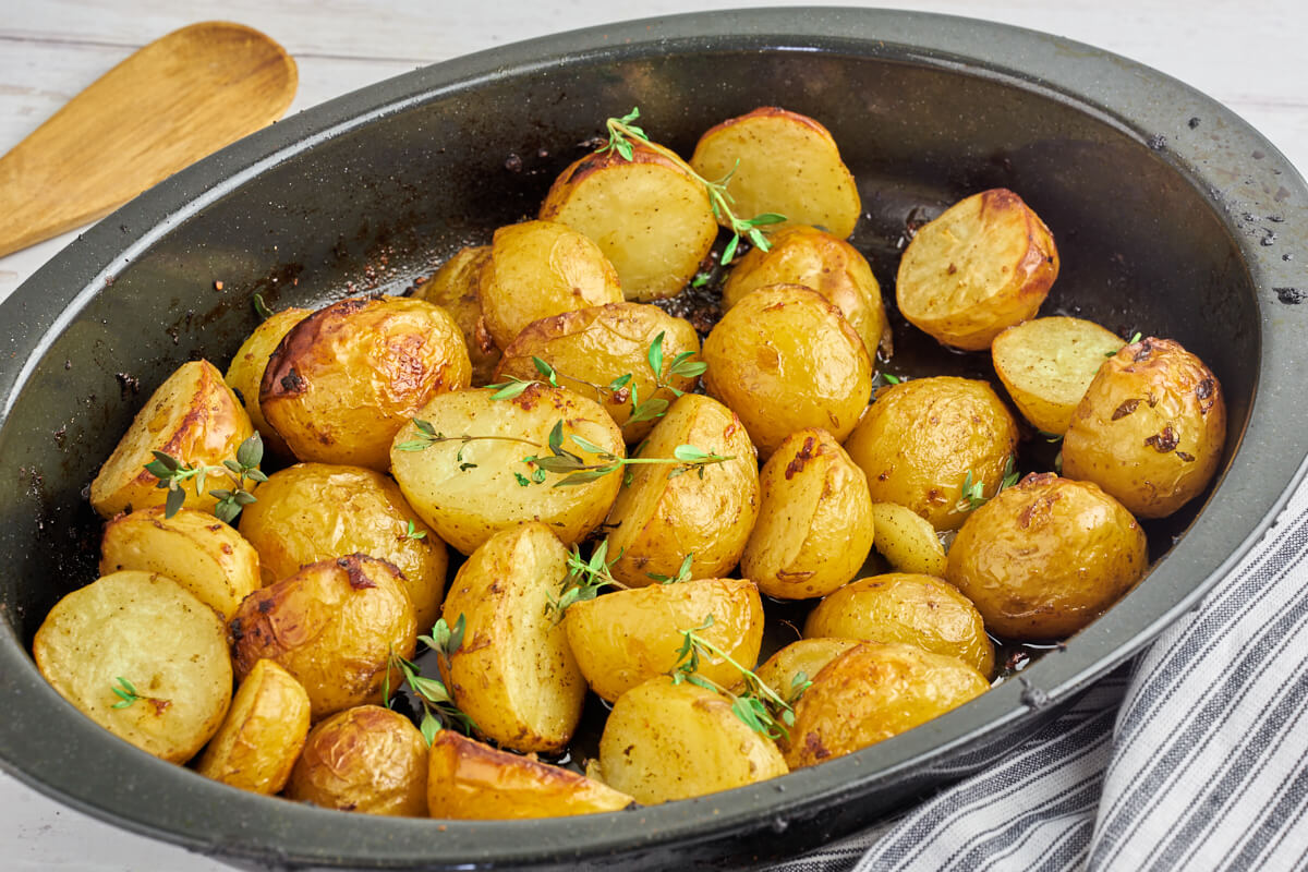 grilled potatoes with herbs in ovenproof dish