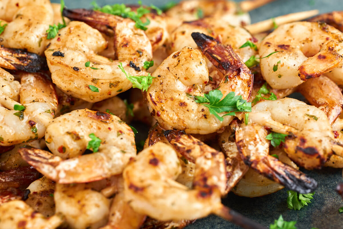 grilled shrimp skewers with marinade and parsley