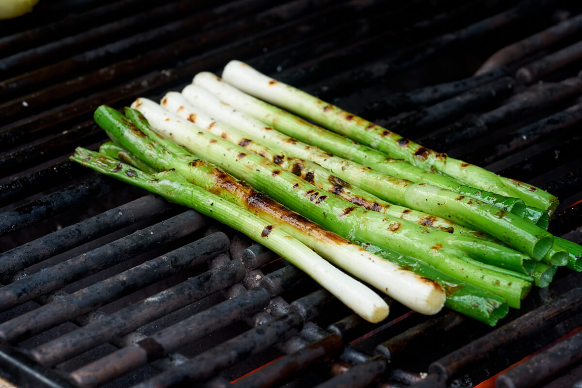 grilled spring onions on bbq rack