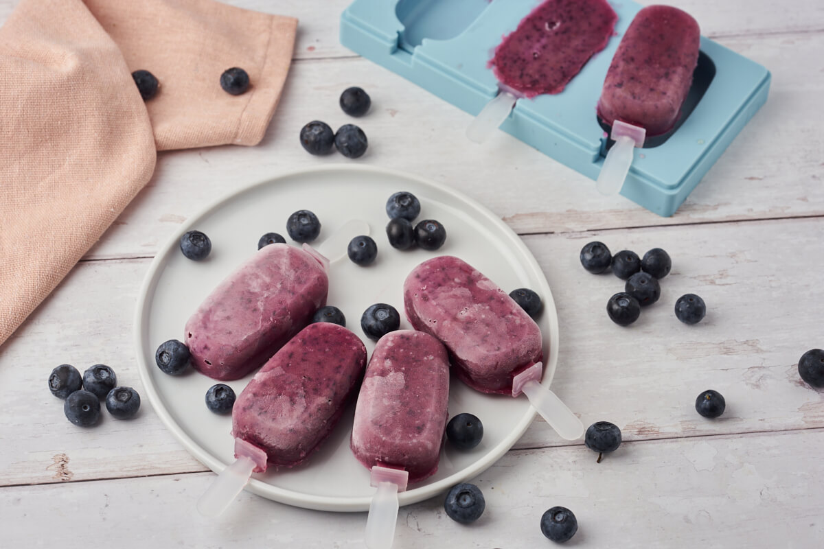 homemade popsicles with blueberries and mold for popsicles