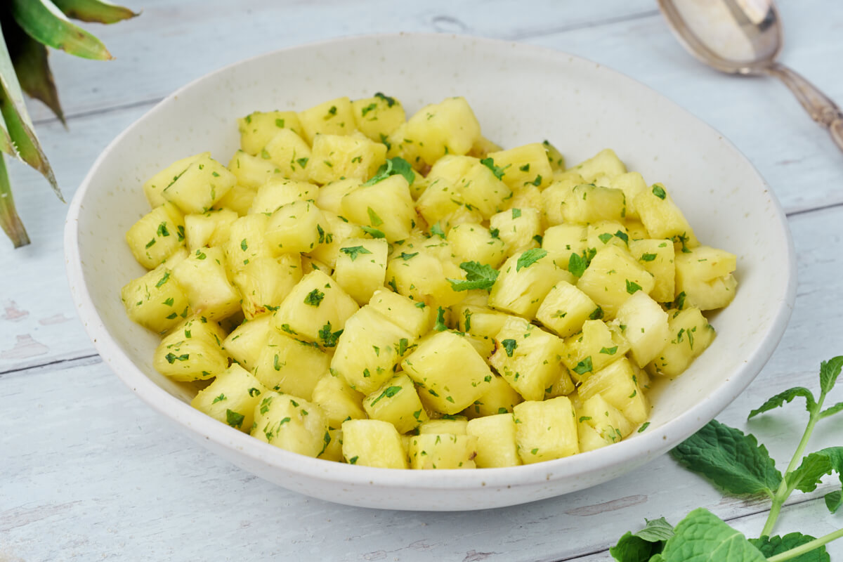 bowl of pineapple with mint sugar