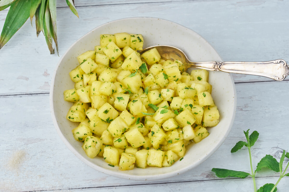 pineapple with mint sugar in dish for dessert