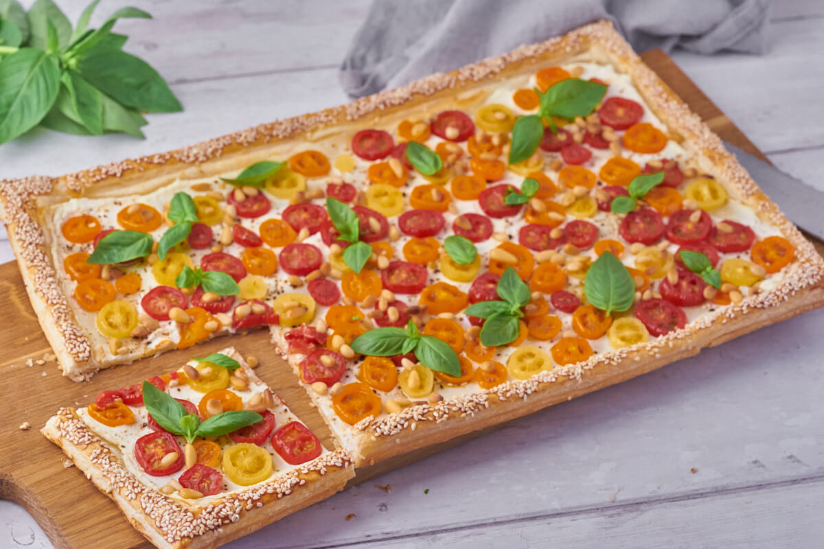 tomato tart with puff pastry and pine nuts and basil