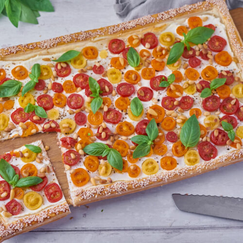 tomato tart on puff pastry with ricotta, pine nuts and basil