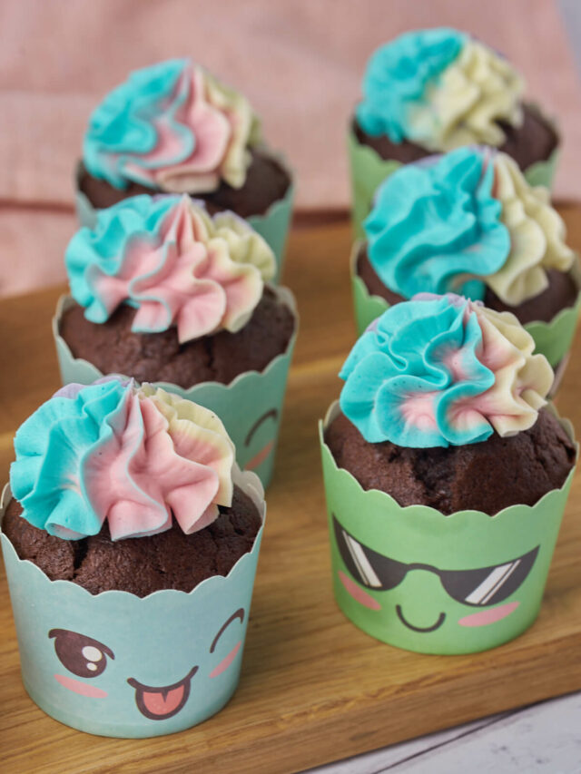 funny cupcakes with faces made of chocolate banana muffins with multicolored buttercream