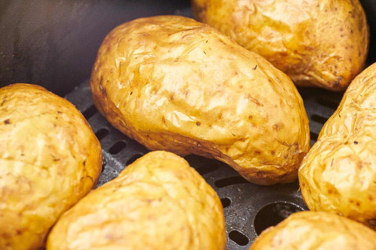 baked potatoes, soft in the middle and crispy on the outside