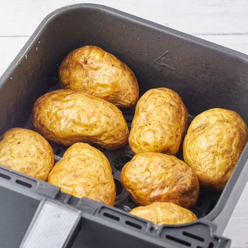 air fryer baked potatoes in air fryer basket