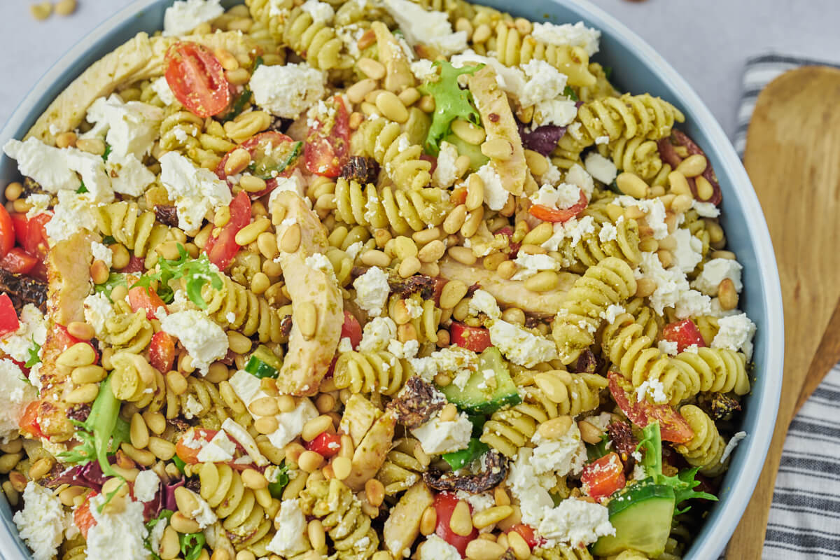 chicken pesto pasta salad in blue bowl