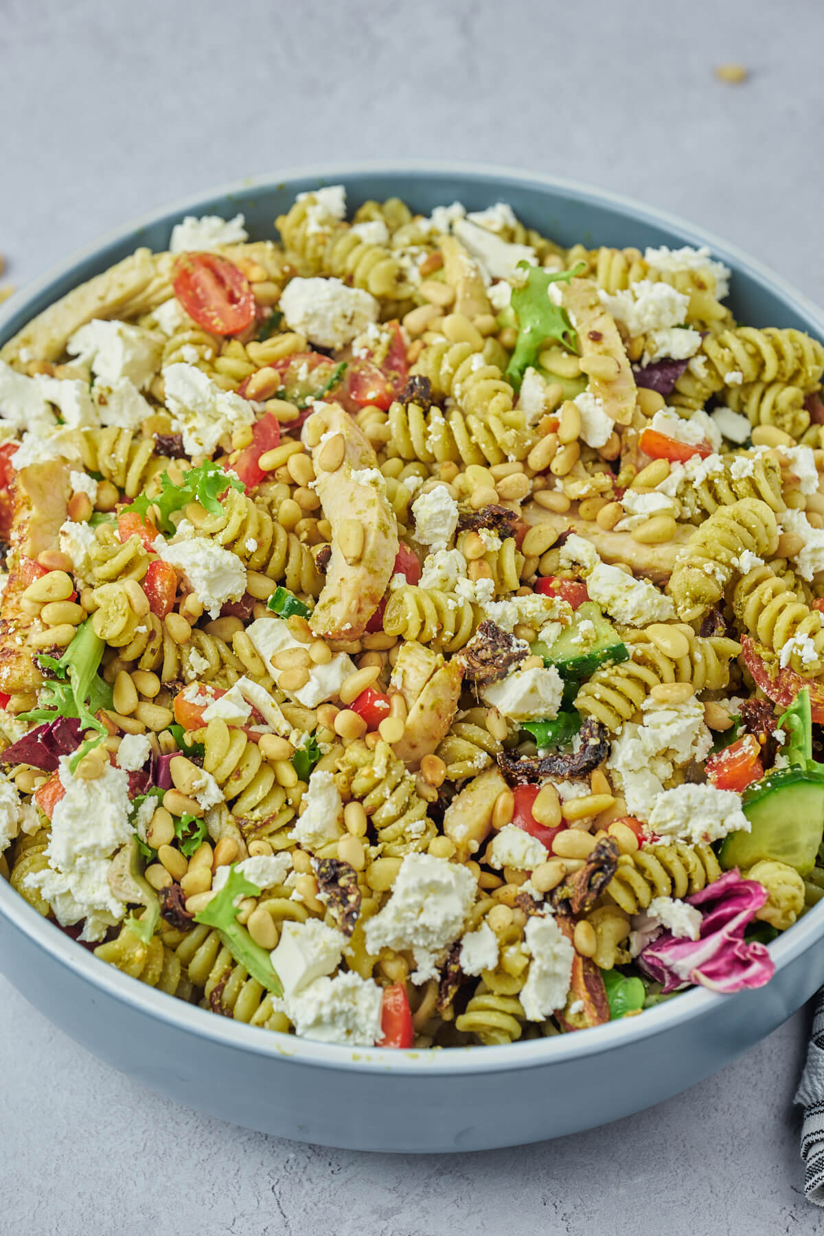 A Danish pasta salad with chicken, pesto, feta and pine nuts