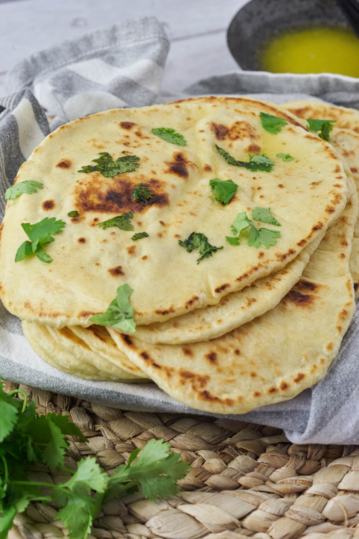 homemade naan bread with butter and fresh coriander