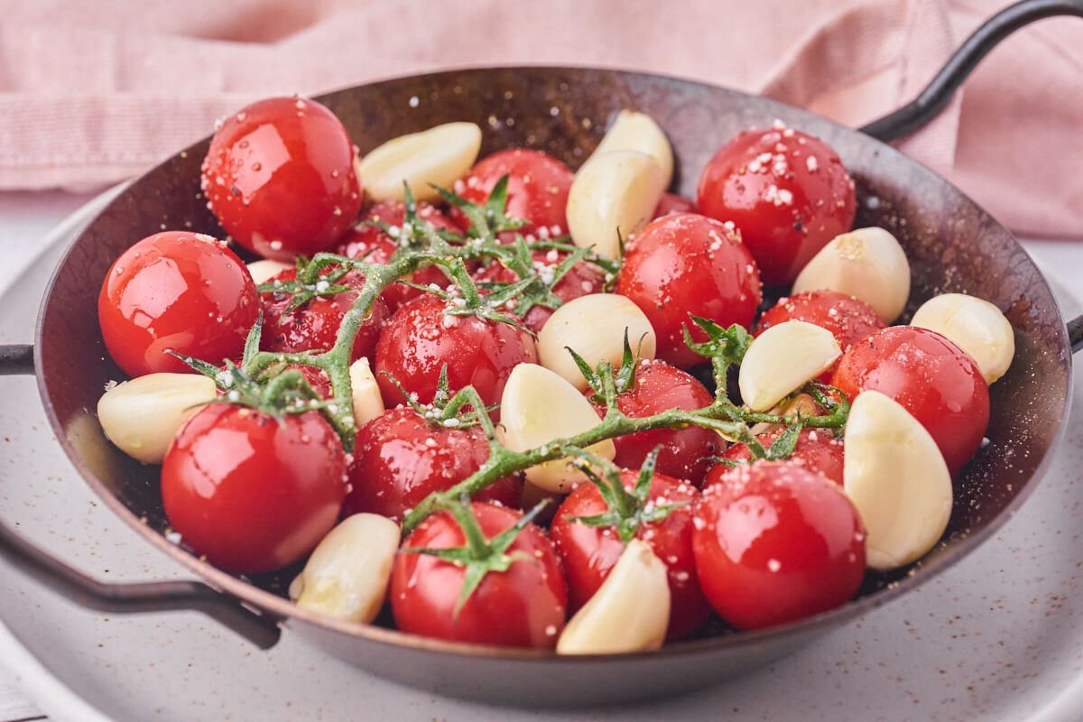 fresh tomatoes with garlic ready for the oven