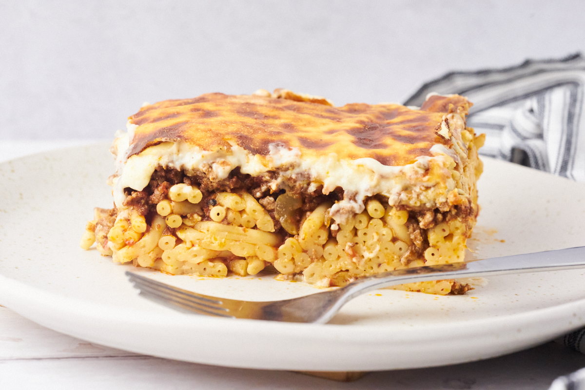 Pastitsio or Greek lasagna on a plate with a fork