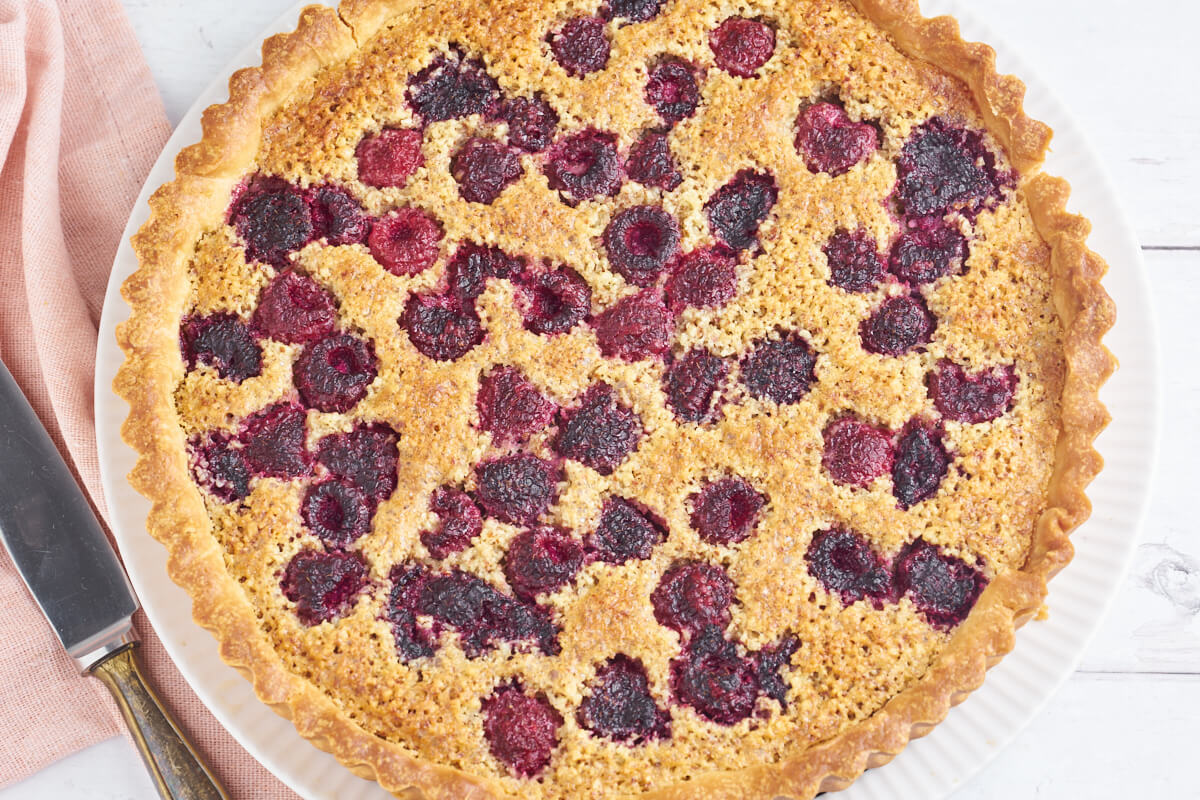 round tart with raspberries and frangipane