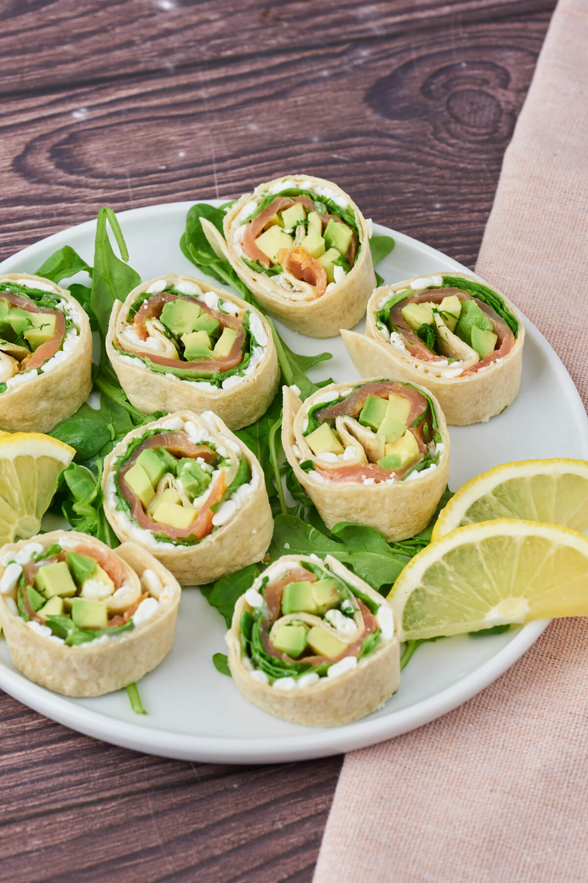 Platter of salmon rolls with cottage cheese and avocado