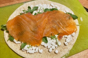 tortilla wrap with cottage cheese, arugula and salmon