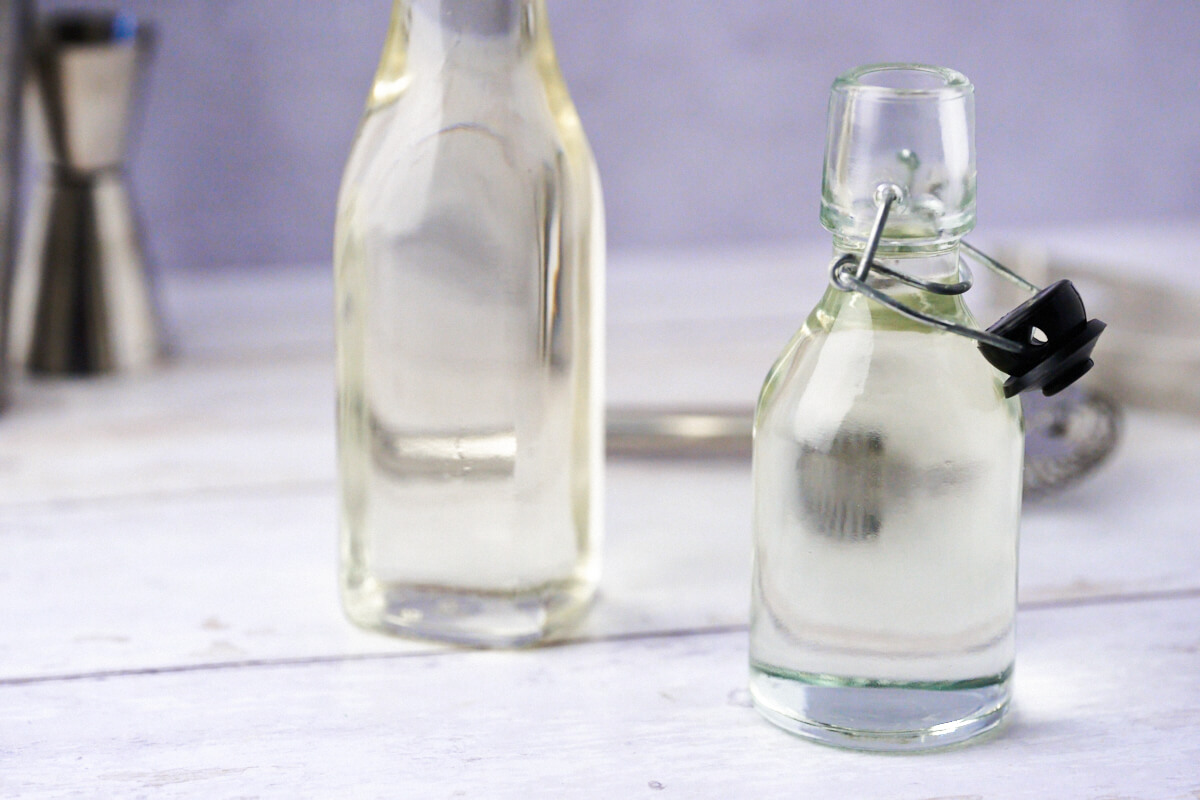 Bottles of homemade simple syrup or sugar cane