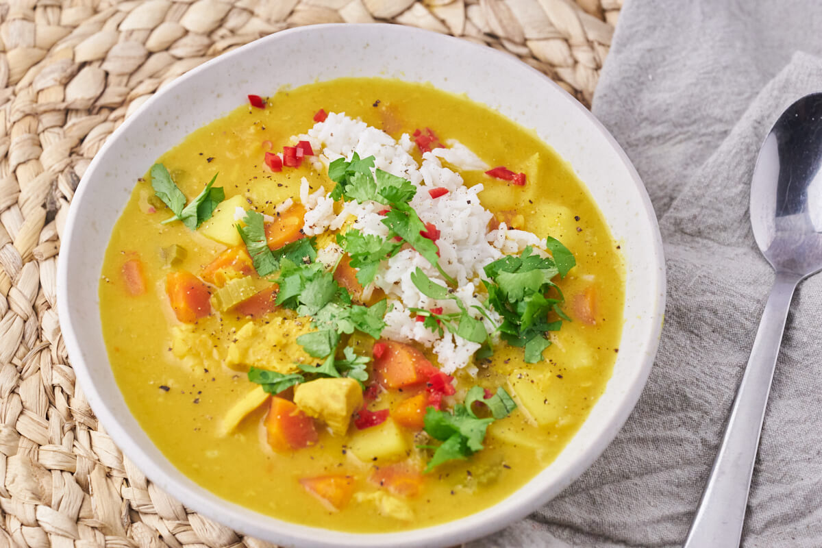 finished servering of mulligatawny on the bowl with topping