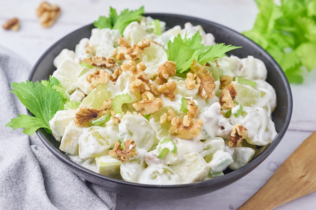 Classic Waldorf salad with apple, celery, grapes, and walnuts.