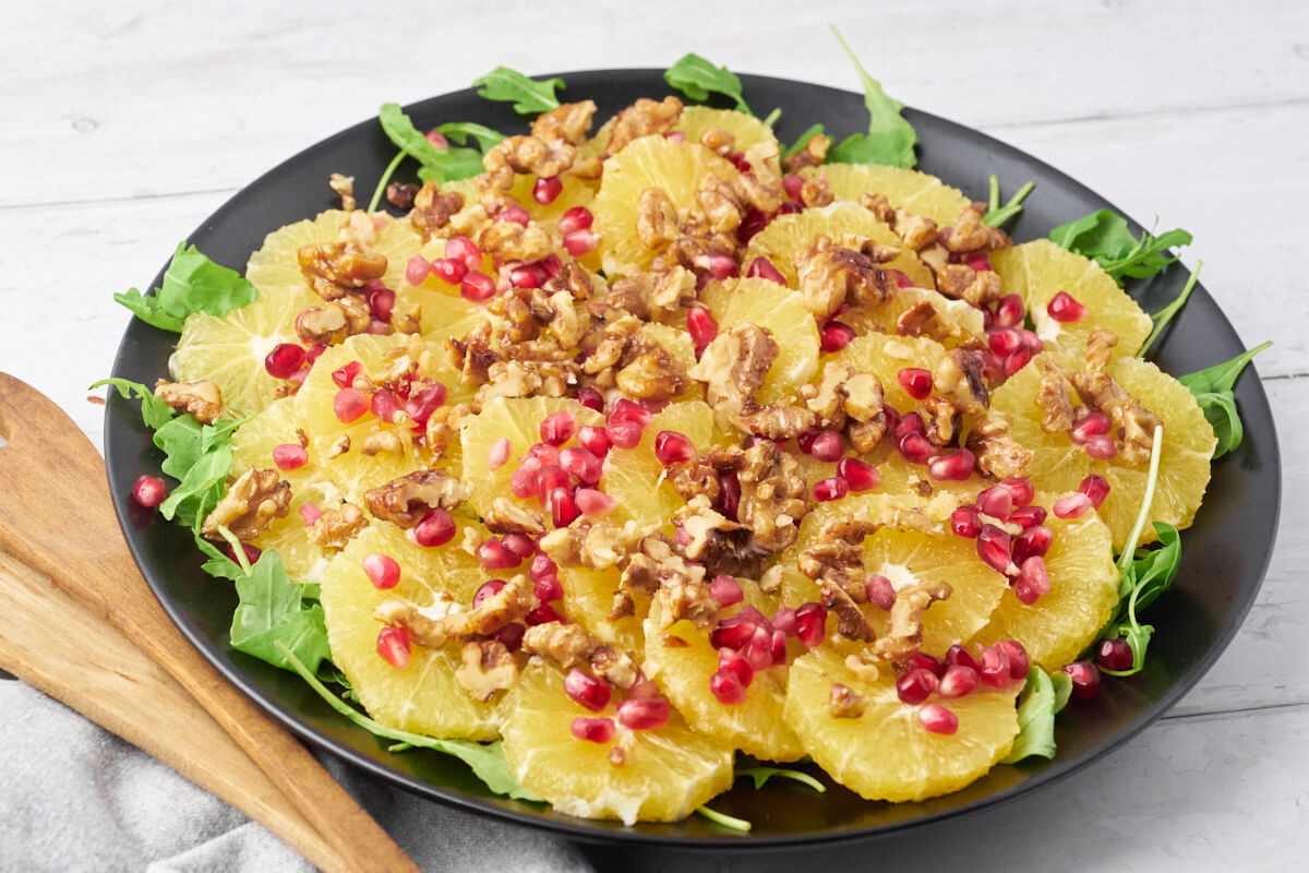 Salad for Christmas Eve or St. Martin's Day with orange and pomegranate.